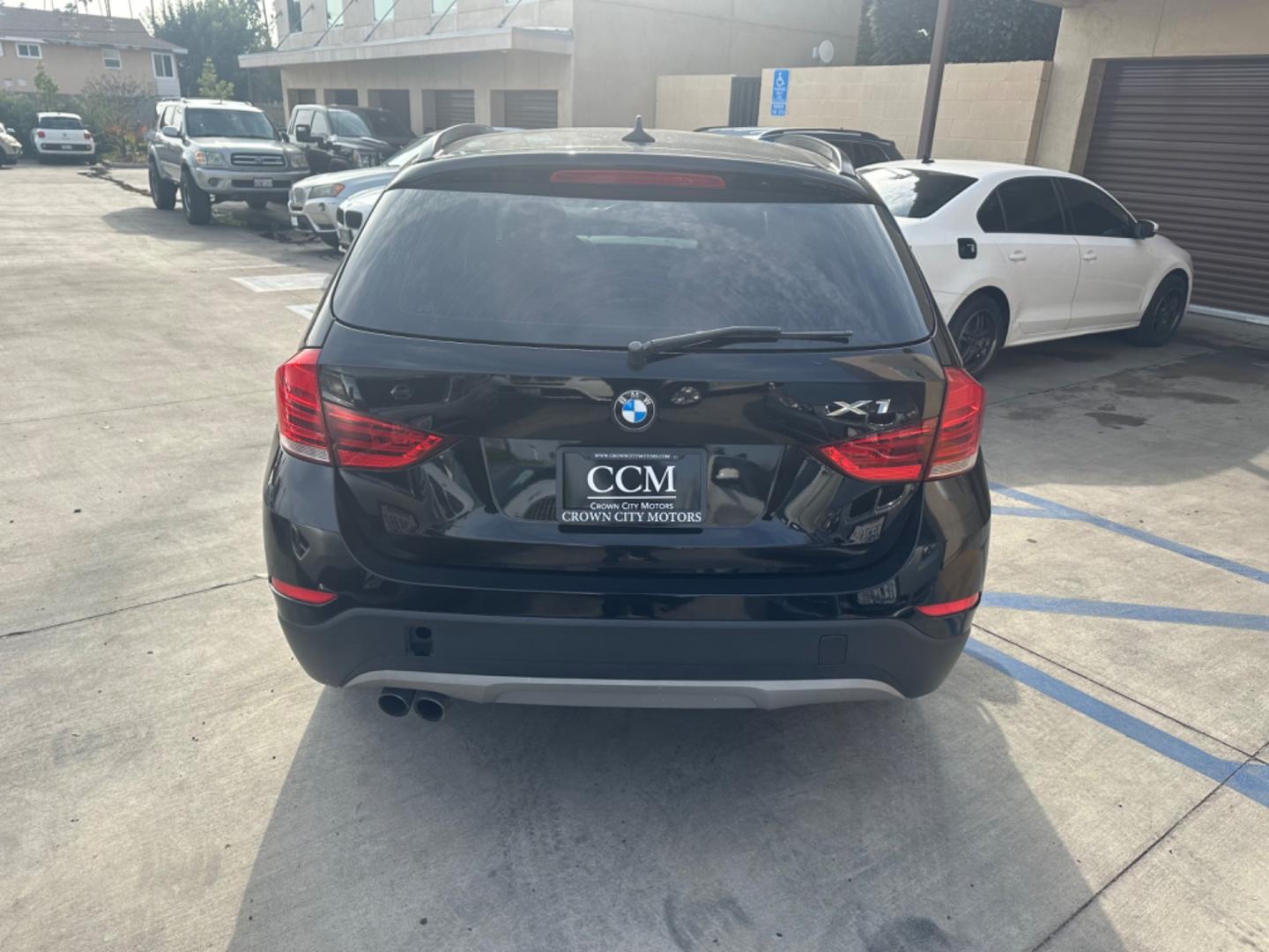 2014 Black /Black BMW X1 (WBAVM1C57EV) with an 4 CYLINDER engine, Automatic transmission, located at 30 S. Berkeley Avenue, Pasadena, CA, 91107, (626) 248-7567, 34.145447, -118.109398 - Photo#4